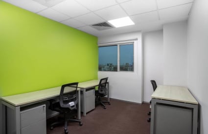 Bright coworking space with desks, ergonomic chairs, and natural light on Harrington Road.