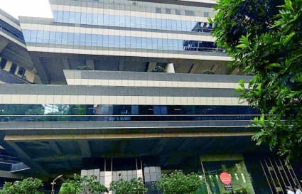 Modern coworking space in Mumbai, featuring sleek architecture and lush surroundings.