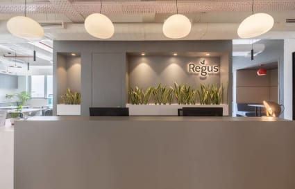 Modern coworking reception with sleek design and ambient lighting in Delhi's Phase 1.