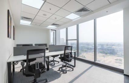 Bright coworking space in Phase 1, Delhi, featuring modern desks and panoramic views.