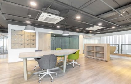 Modern coworking space with sleek seating and ample natural light on Judges Bunglow Road.