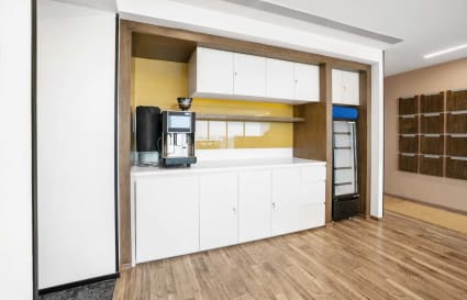 Sleek coffee area in a modern coworking space on Nava India Road, Tamil Nadu.
