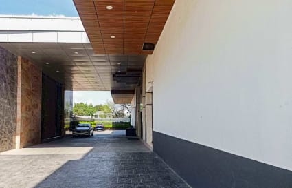 Spacious entryway in a flexible Madhya Pradesh coworking space, featuring modern design elements.
