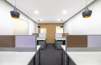 Modern coworking space with stylish lighting and spacious workstations on Doctor Annie Besant Road.