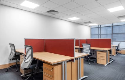 Modern coworking space with ergonomic chairs and private desks near Jalagam Vengala Rao Park.