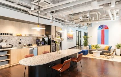 Stylish coworking space with modern decor, open seating, and a welcoming communal area.