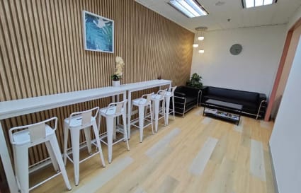 Sleek coworking area with stylish seating, natural light, and modern decor in Jalan Pinang.