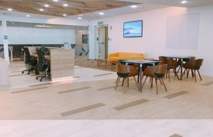 Modern coworking space in Selangor with versatile seating and sleek, welcoming design.