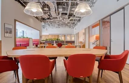 Modern coworking space with vibrant seating, open layout, and natural light in Western Bicutan.