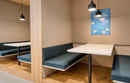 Cozy booth seating in a modern Makati coworking space, perfect for collaborative work.