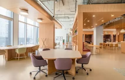 Modern coworking space with open layout, natural light, and stylish furnishings in Taguig.