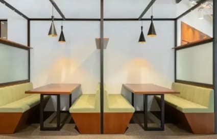 Modern coworking space with cozy booth seating and stylish lighting in Taguig.