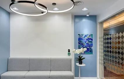 Modern coworking space with stylish seating, artistic decor, and sleek lighting on Gen. Malvar Street.