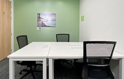 Modern coworking space with ergonomic chairs, large desks, and vibrant decor in Metro Manila.