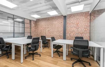 Modern coworking space with natural light, brick accents, and ergonomic seating in Olongapo.