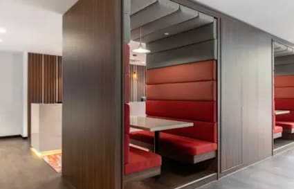 Modern coworking booths with plush seating in Kondapur. Ideal for focused work and collaboration.