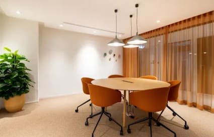 Modern coworking space with stylish seating, natural light, and inviting decor on Infopark Road.