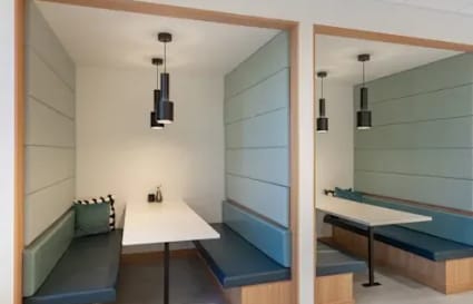 Cozy booth seating with modern lighting, perfect for collaborative work at Harbourfront Place.