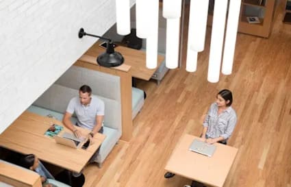 Modern coworking space in Hyderabad with collaborative seating and stylish lighting.