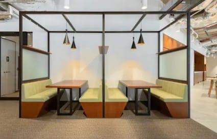 Modern booth seating in a flexible Harbourfront coworking space, perfect for casual meetings.