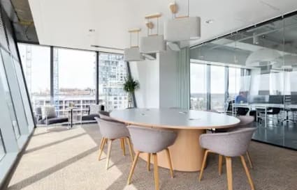 Modern coworking space in Zirakpur with spacious seating, natural light, and a sleek meeting area.