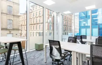 Bright, modern coworking space with large windows and ergonomic furnishings on White Field Road.