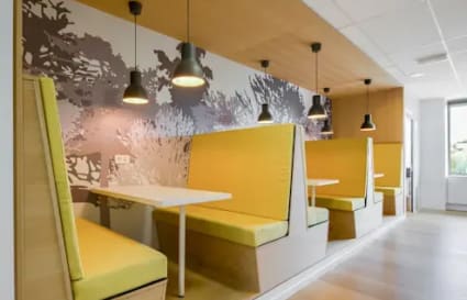 Bright, modern coworking booths with ample lighting on Cenotaph Road, perfect for collaboration.