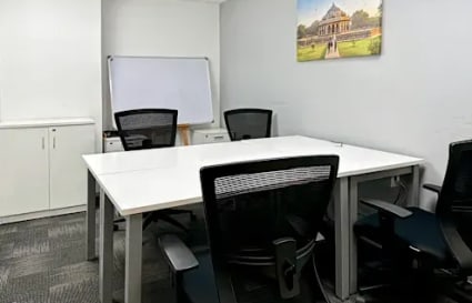 Modern coworking space in Gomti Nagar with sleek desks, ergonomic chairs, and natural light.