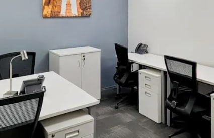 Modern coworking space with ergonomic chairs, ample storage, and natural lighting.