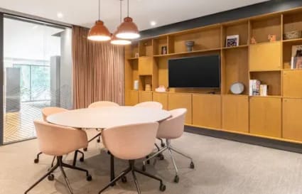 Modern coworking space with stylish seating, ample storage, and natural light in Electronic City.