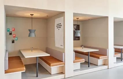 Modern coworking nooks with cozy seating, ideal for collaboration in Kozhikode Bypass.