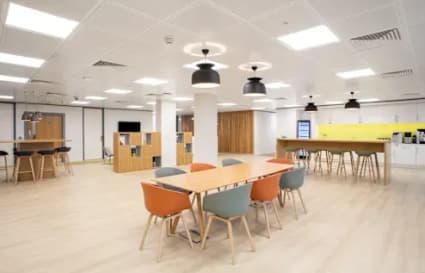 Bright coworking space in Rajiv Gandhi Salai, featuring modern furnishings and ample natural light.