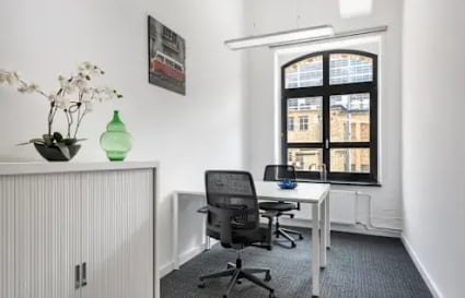 Bright office space with modern furnishings and ample natural light on Cenotaph Road.