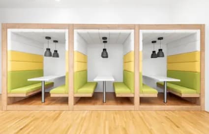 Vibrant, modern pods ideal for focused work or team meetings in a flexible coworking space.