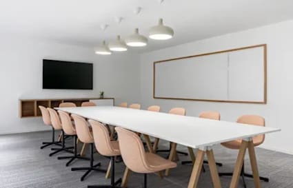 Sleek conference room in Wardha Road coworking space, featuring modern lighting and ample seating.