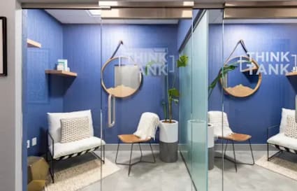 Sleek, modern coworking space in Navi Mumbai with cozy seating and stylish decor.