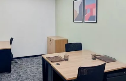 Modern coworking space with sleek desks, ample lighting, and tasteful decor in Powai.