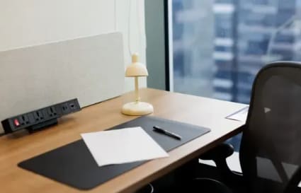 Sleek, modern workspace with ergonomic chair and natural light. Ideal for productivity.