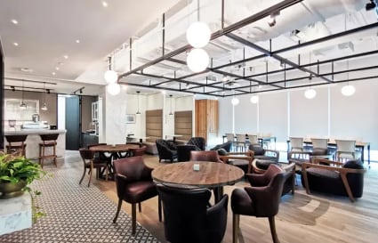 Stylish coworking space in Collyer Quay featuring modern furnishings and ample natural light.