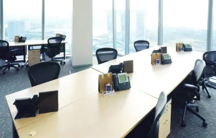 Bright coworking space with expansive city views and ergonomic seating in Collyer Quay.