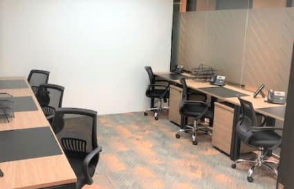 Modern coworking space with ergonomic chairs and sleek workstations in Singapore.