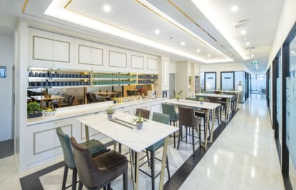 Modern coworking space with elegant seating, ample natural light, and a stylish communal area.
