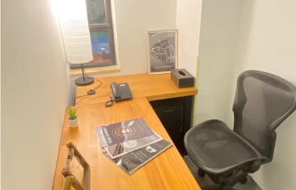 Cozy, private workspace with ergonomic chair and natural light on Hysan Avenue.