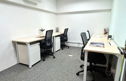 Modern coworking space with ergonomic chairs and spacious desks in Kowloon.