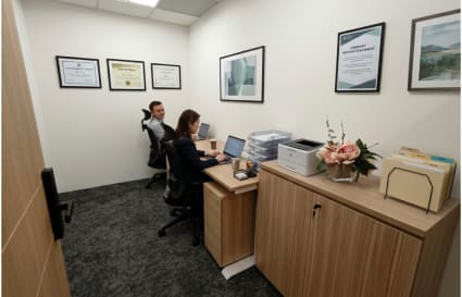 Modern coworking office with workstations, ample storage, and professional decor in Raffles Place.