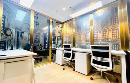Stylish coworking space with modern desks and chairs. Ideal for collaborative work.