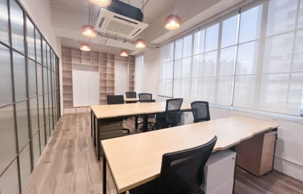 Bright and modern coworking space with ample natural light and ergonomic seating on Wong Chuk Hang Road.