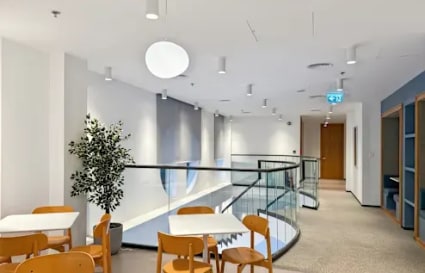 Bright, modern coworking space with open layout and stylish seating in Port Saeed Deira.