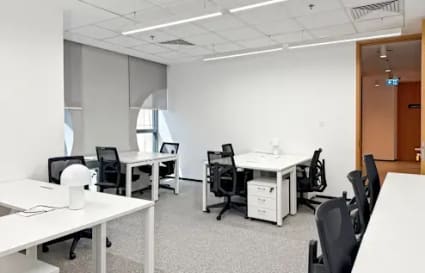 Modern coworking space with sleek desks, comfy chairs, and abundant natural light in Port Saeed.