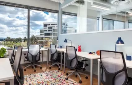 Bright, modern coworking space with vibrant decor and natural light in Dubai's 17th Street area.